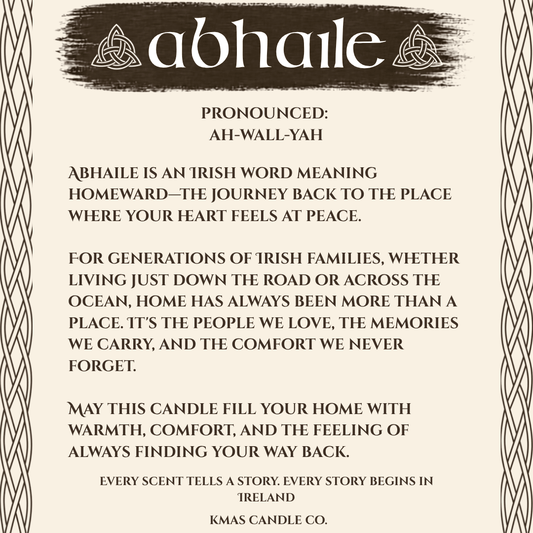 Abhaile | Wooden Wick Candle - KMAS Candle Co-Candles-KMAS Candle Co-A text-based product graphic for Abhaile candle scent by Kmas Candle Co., with the title 'abhaile' in white on a dark brown banner, pronunciation guidance, and descriptive copy on a beige background with decorative border lines.